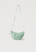 AURA CRESCENT CROSSBODY UNISEX - Cross body bag - mint/gold-coloured