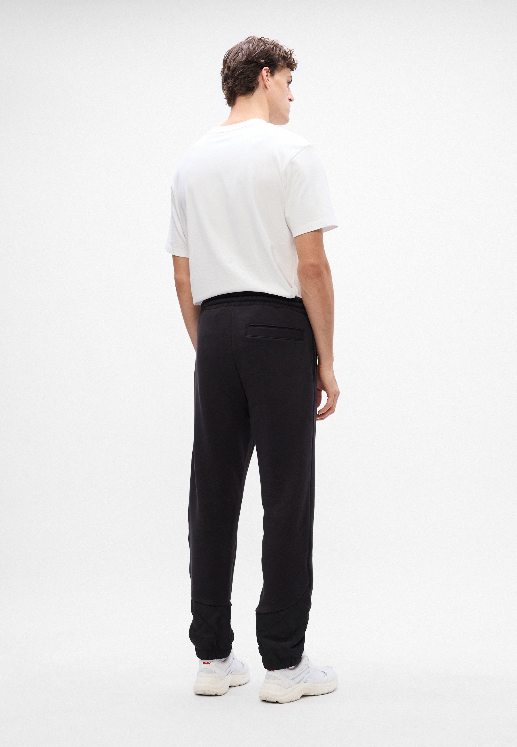 DILVANOS - Tracksuit bottoms - black