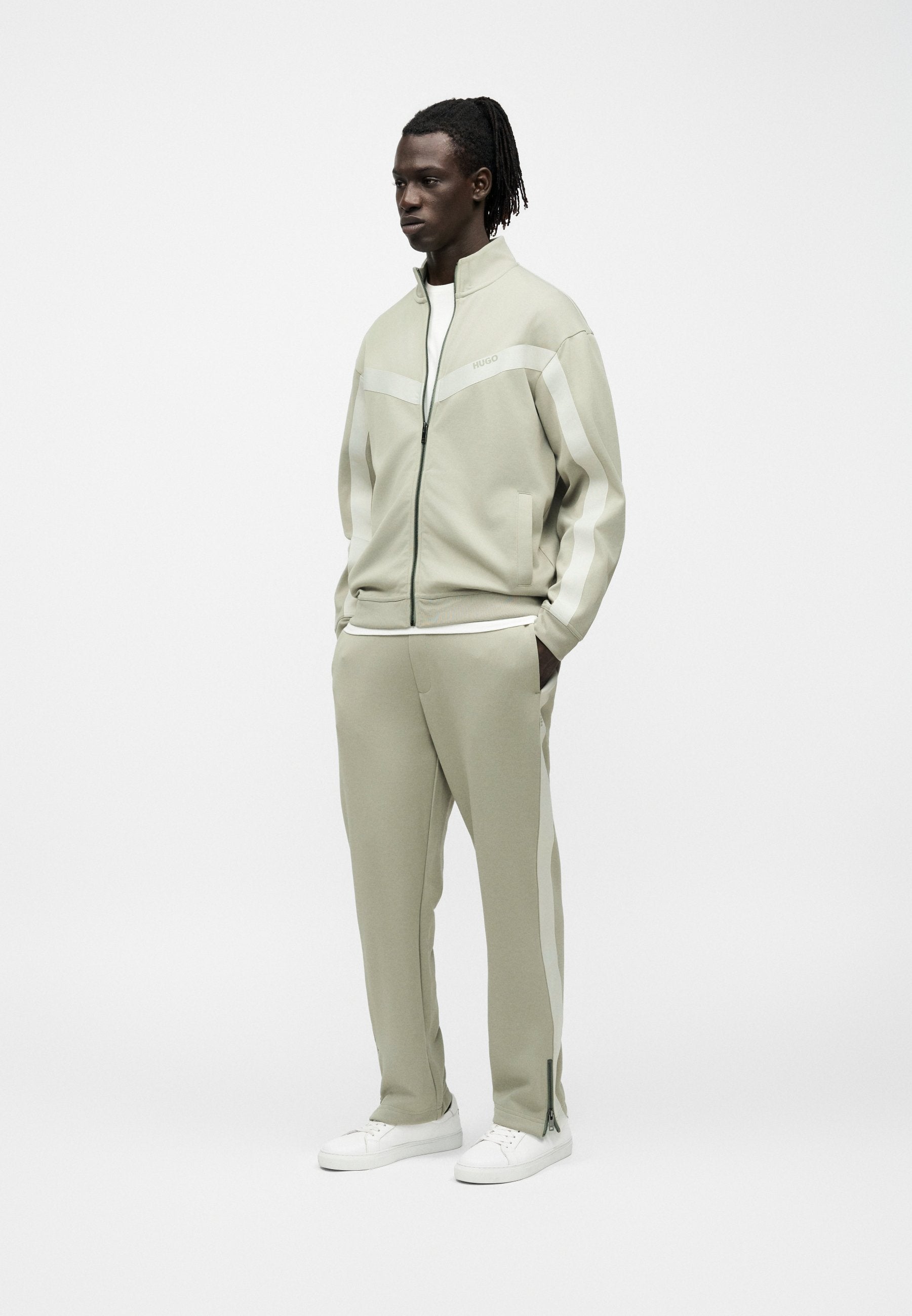 DOLOS - Tracksuit bottoms - pastel green