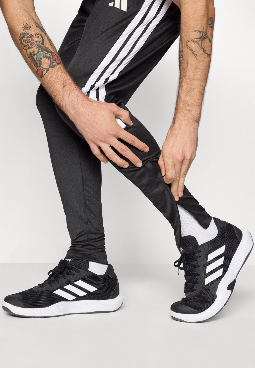 TIRO - Tracksuit bottoms - black/white
