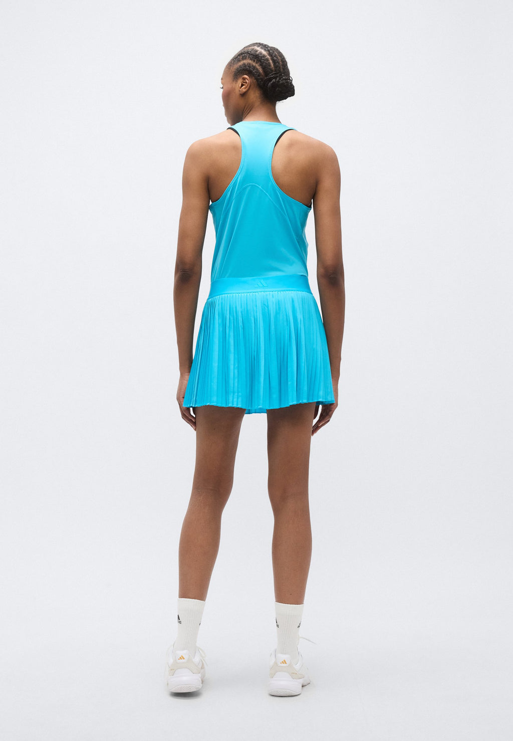 تنورة رياضية CLUB PLEATSKIRT - سيان إشارة